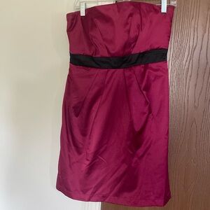 Pink and black strapless cocktail length dress.